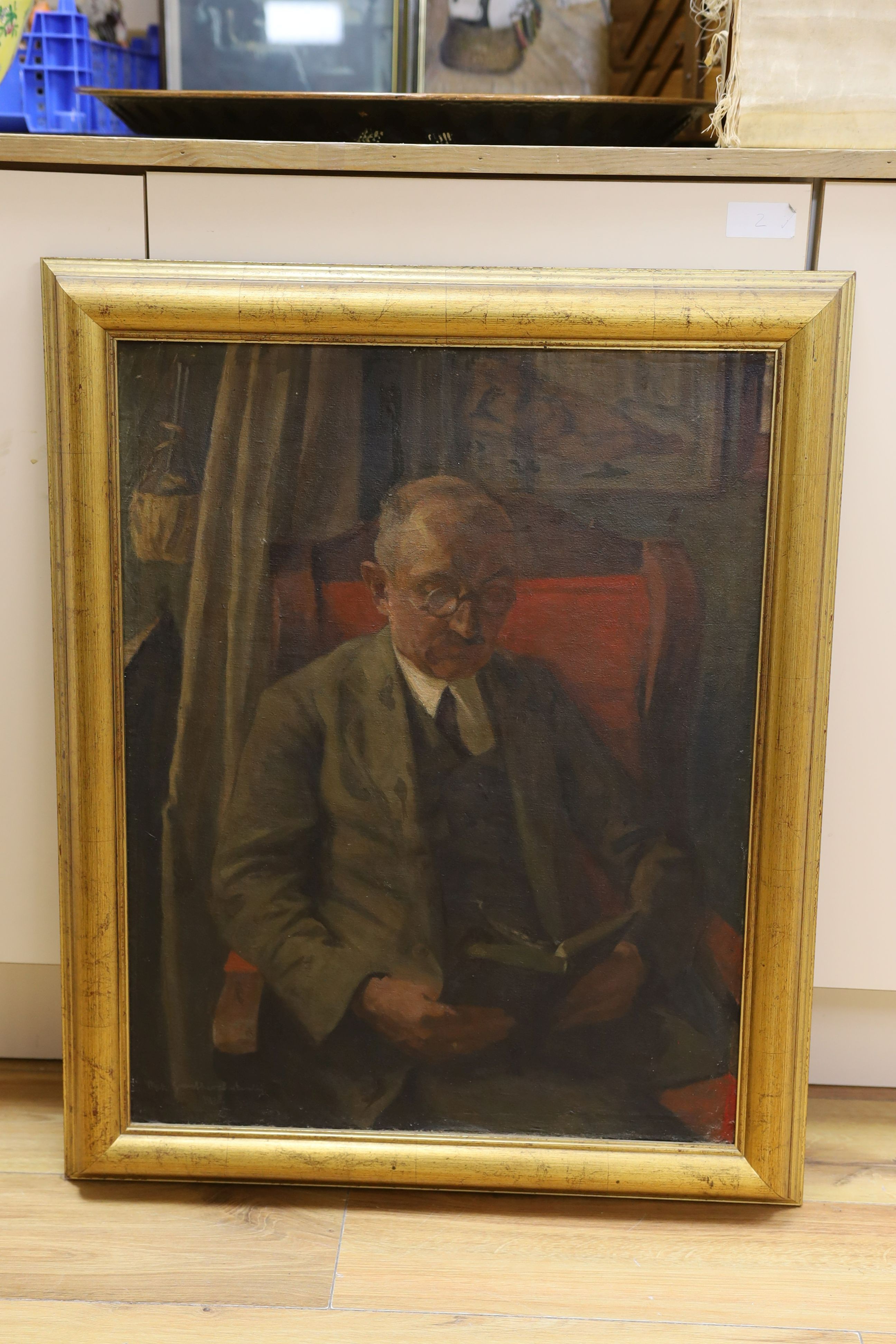 Max Guenther, oil on canvas laid on board, Portrait of a gentleman reading a book, signed and dated 1918, 63 x 49cm